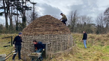 1.StudentsBuildingEarlyMedievalroundhouseatCEAMC.jpeg