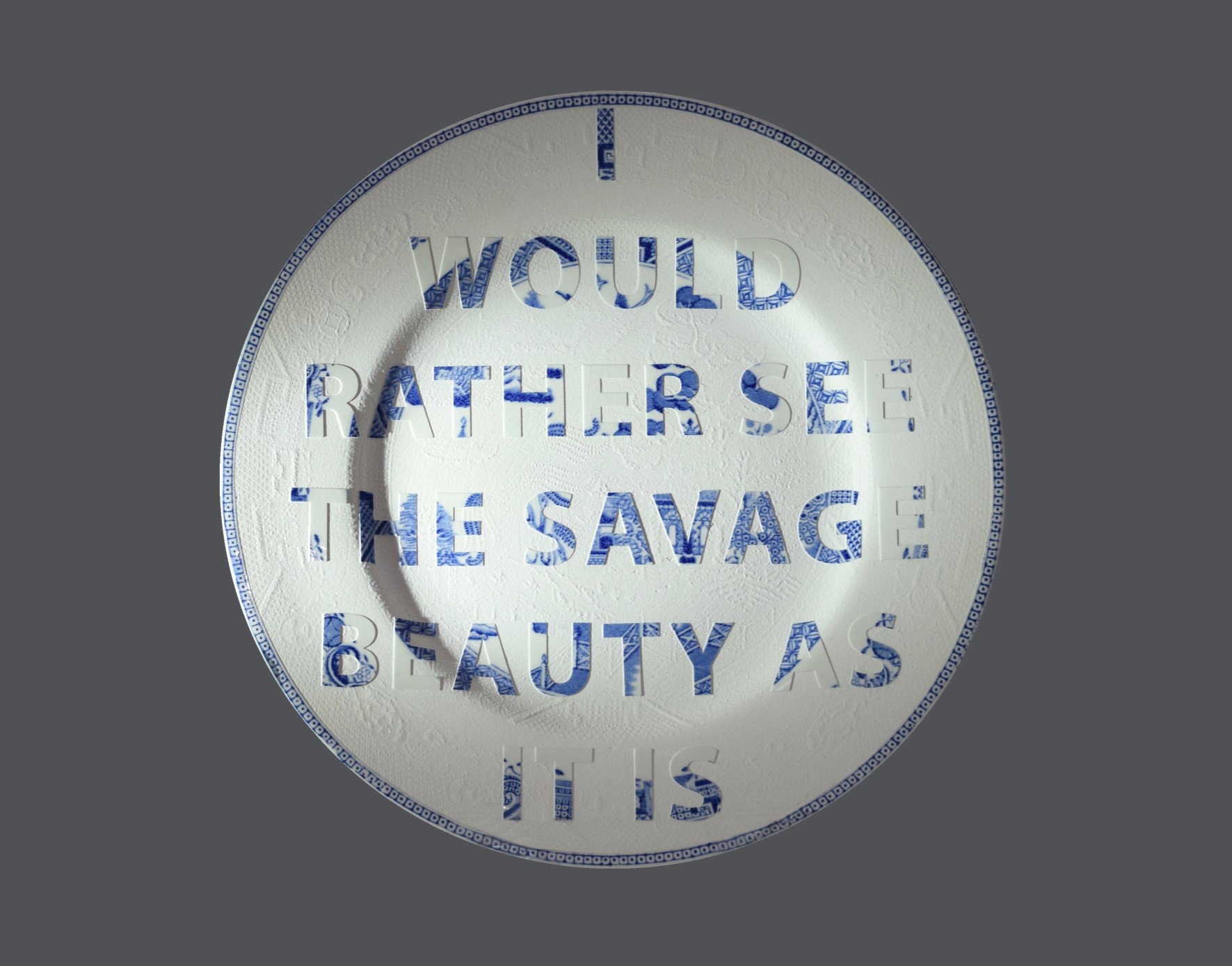 A blue and white plate with words on 