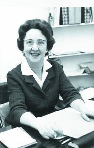 black and white image of a woman smiling at the camera
